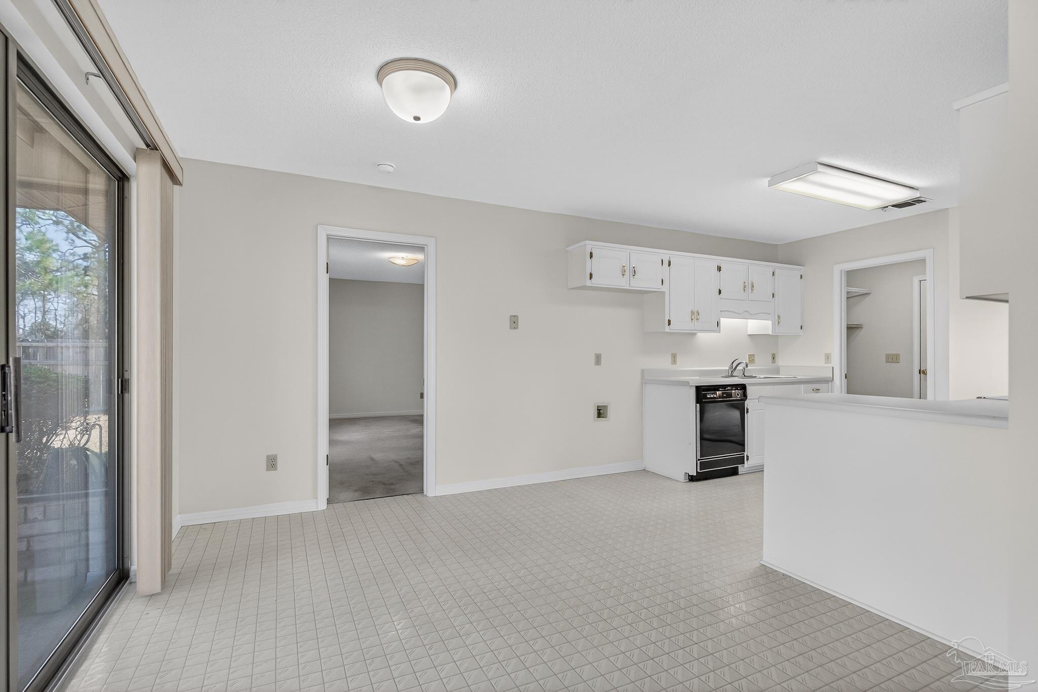 2236 Cricket Ridge Drive Cantonment, FL 32533 - Photo 23 of 57 a view of kitchen with refrigerator and window