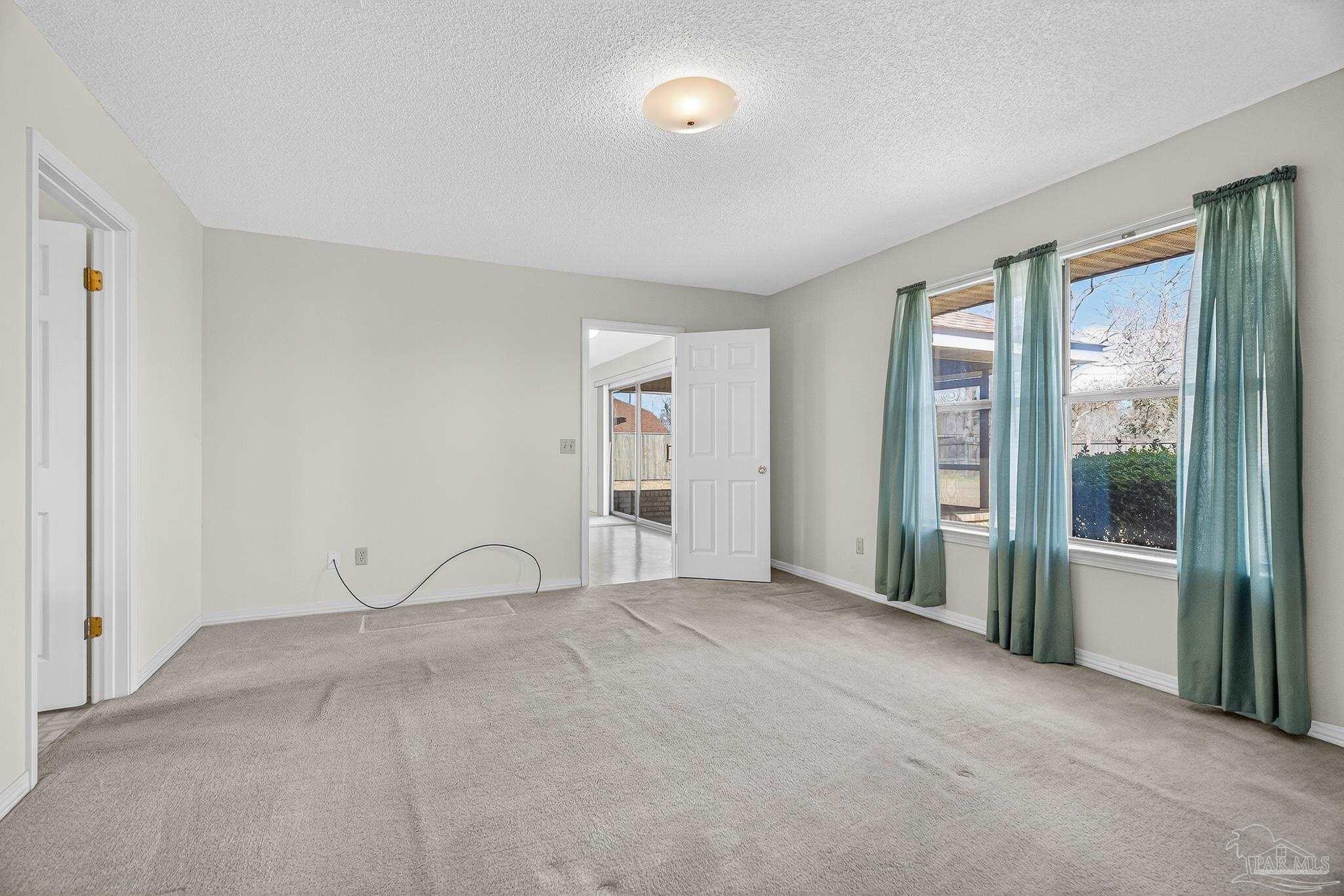 2236 Cricket Ridge Drive Cantonment, FL 32533 - Photo 27 of 57 a view of an empty room with a window