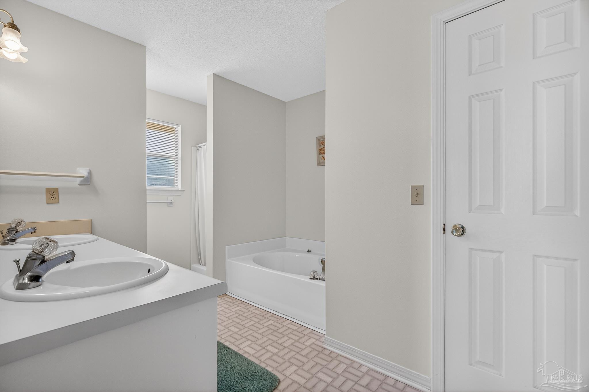 2236 Cricket Ridge Drive Cantonment, FL 32533 - Photo 33 of 57 a bathroom with a sink and a bathtub