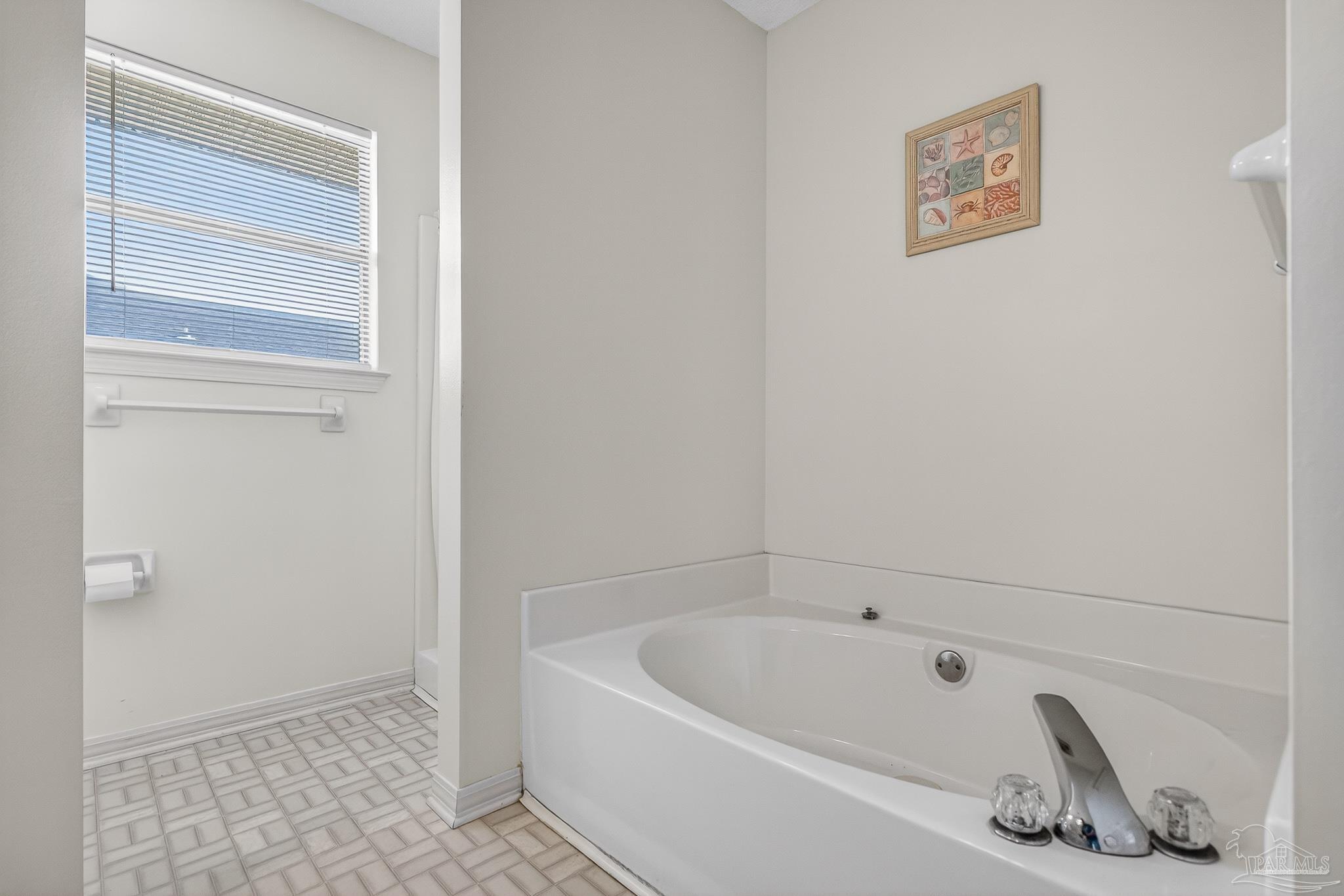 2236 Cricket Ridge Drive Cantonment, FL 32533 - Photo 34 of 57 a bathroom with a tub