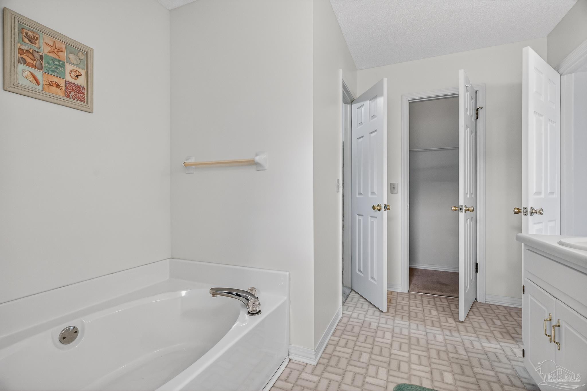 2236 Cricket Ridge Drive Cantonment, FL 32533 - Photo 36 of 57 a bathroom with a bathtub and shower