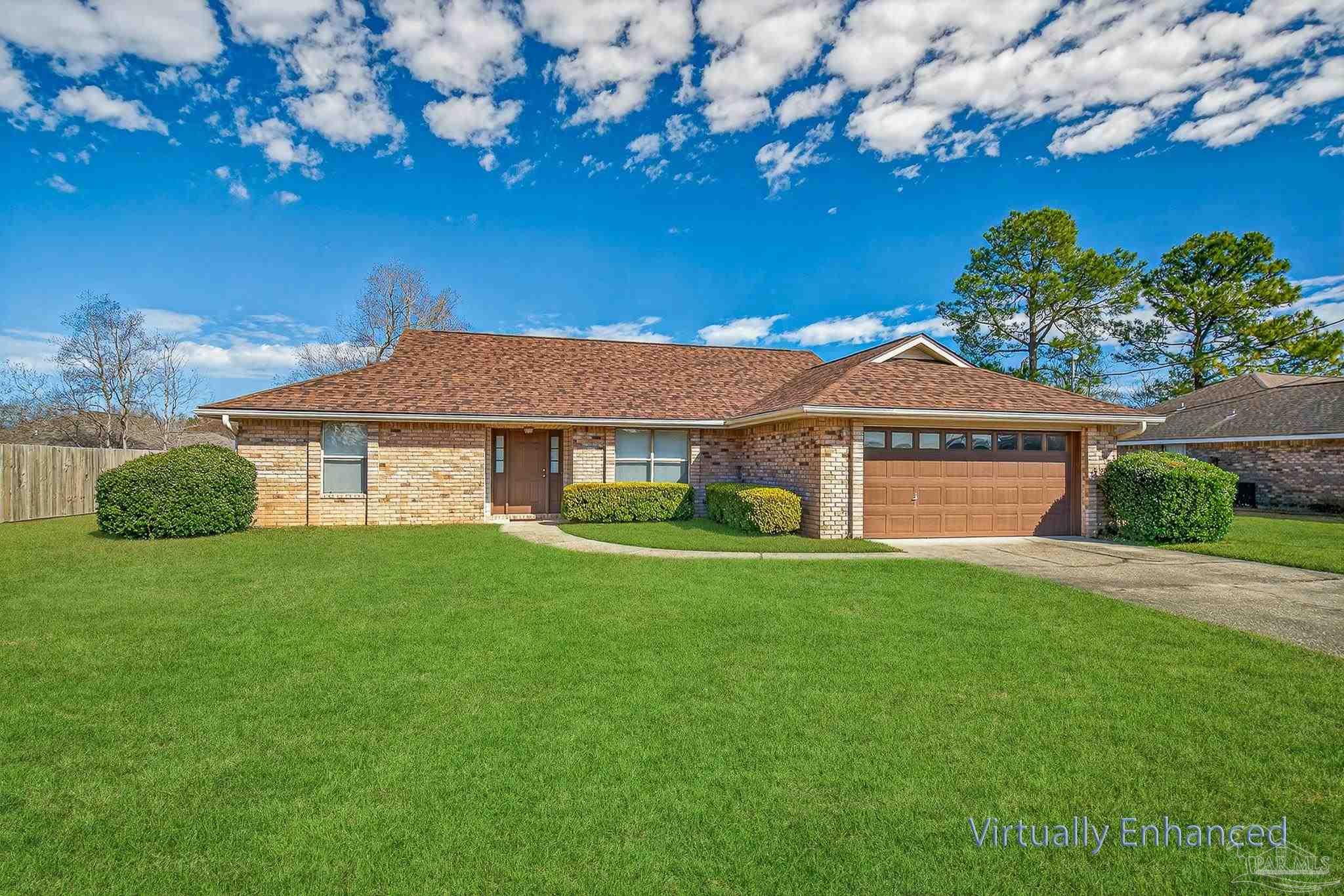 2236 Cricket Ridge Drive Cantonment, FL 32533 - Photo 4 of 57 a front view of a house with a yard