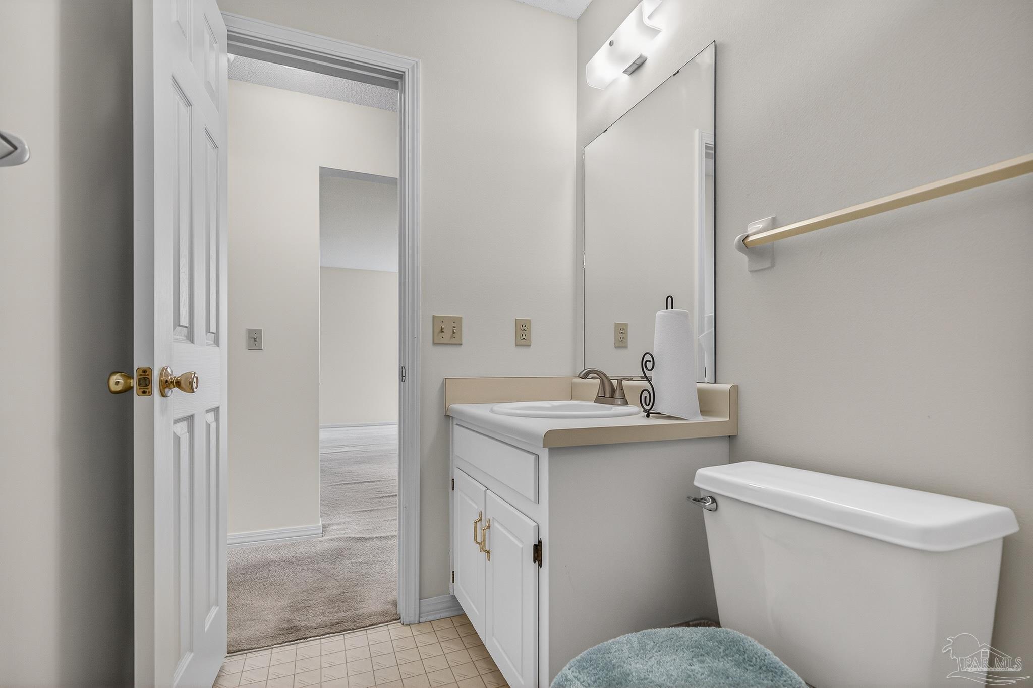 2236 Cricket Ridge Drive Cantonment, FL 32533 - Photo 44 of 57 a bathroom with a toilet sink and mirror