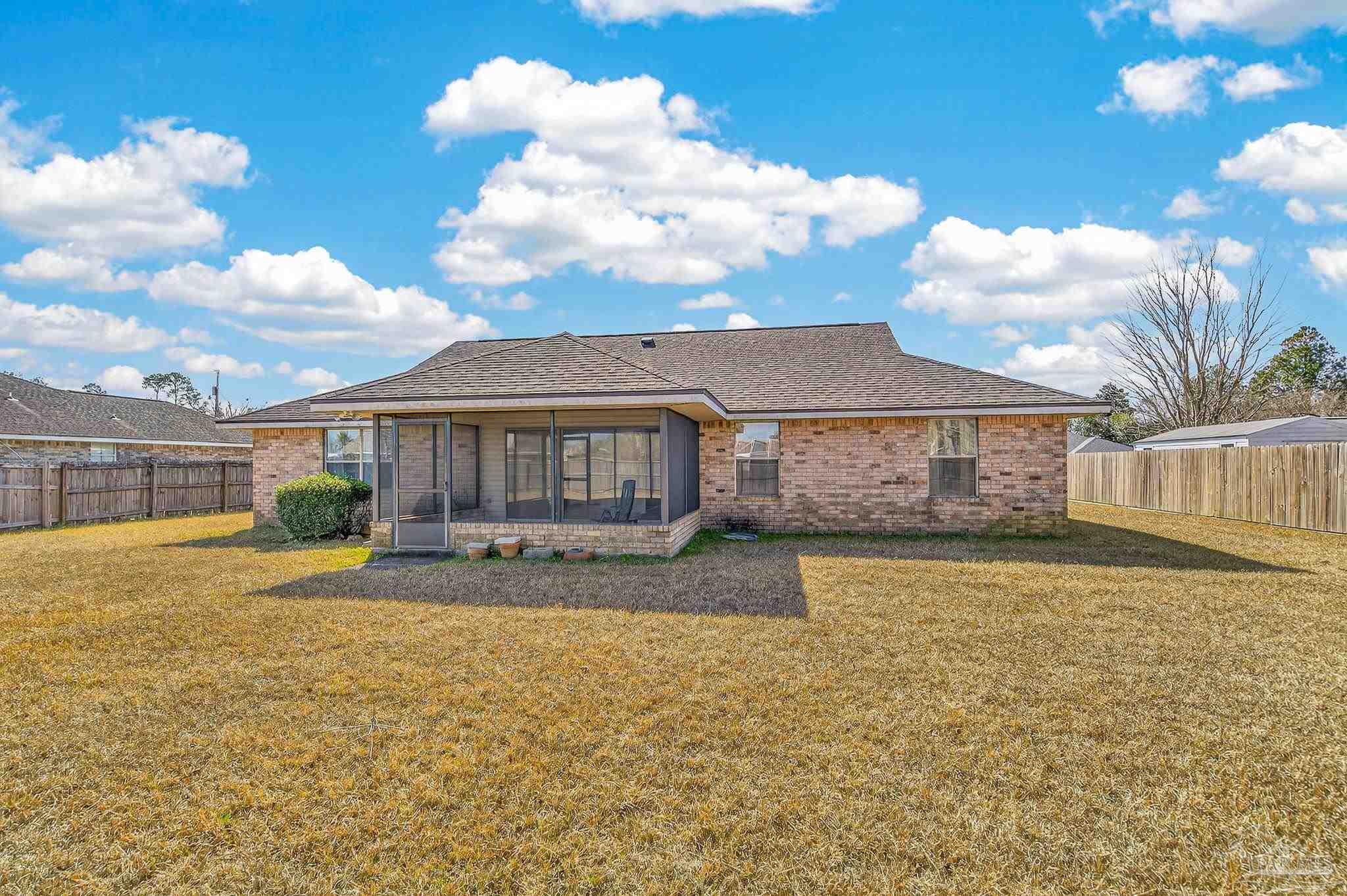 2236 Cricket Ridge Drive Cantonment, FL 32533 - Photo 51 of 57 a front view of a house with a yard