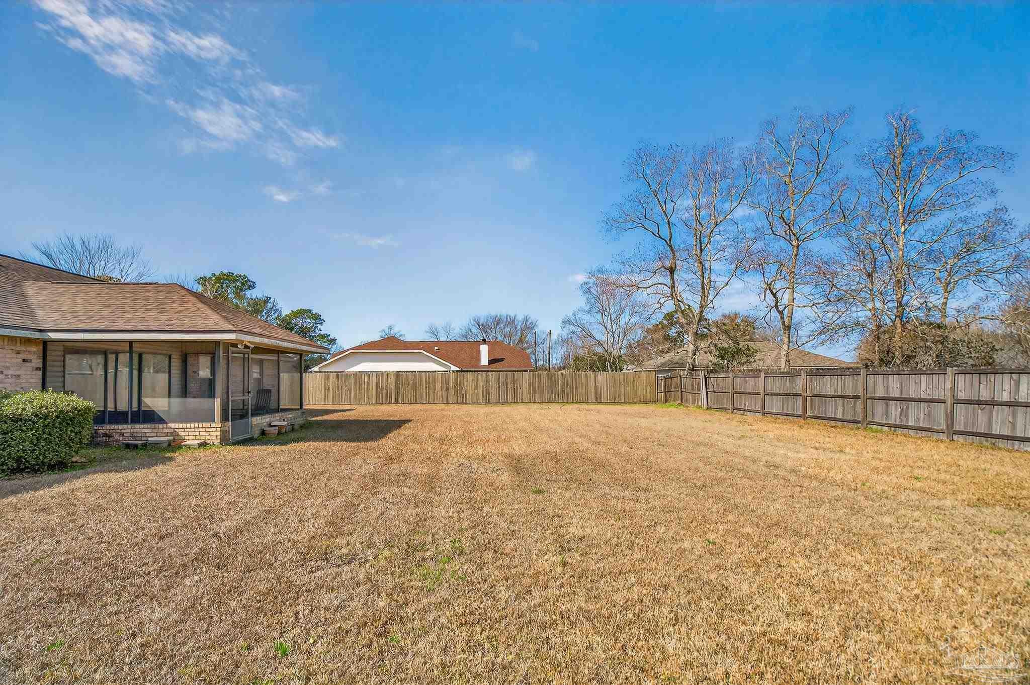 2236 Cricket Ridge Drive Cantonment, FL 32533 - Photo 53 of 57 a front view of a house with a yard and covered with snow
