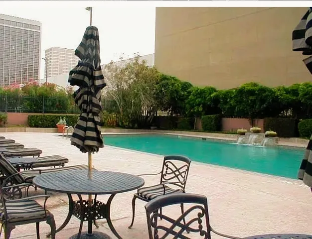 a table and chairs sitting in the garden