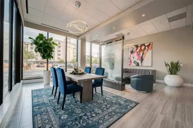 a view of a dining room with furniture window and wooden floor