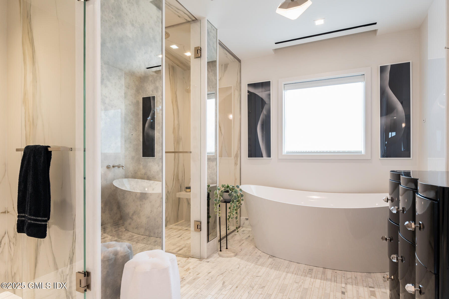 125 Field Point Road, Unit PH A6 Greenwich, CT 06830 - Photo 11 of 22 a white bath tub sitting next to a bathroom