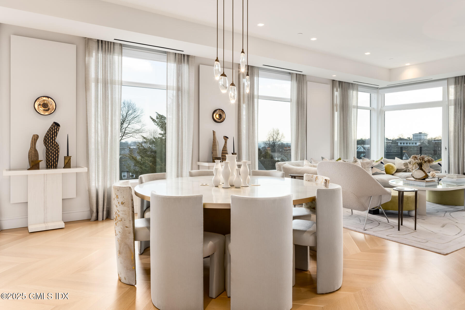 125 Field Point Road, Unit PH A6 Greenwich, CT 06830 - Photo 7 of 22 a view of a dining room with furniture window and wooden floor