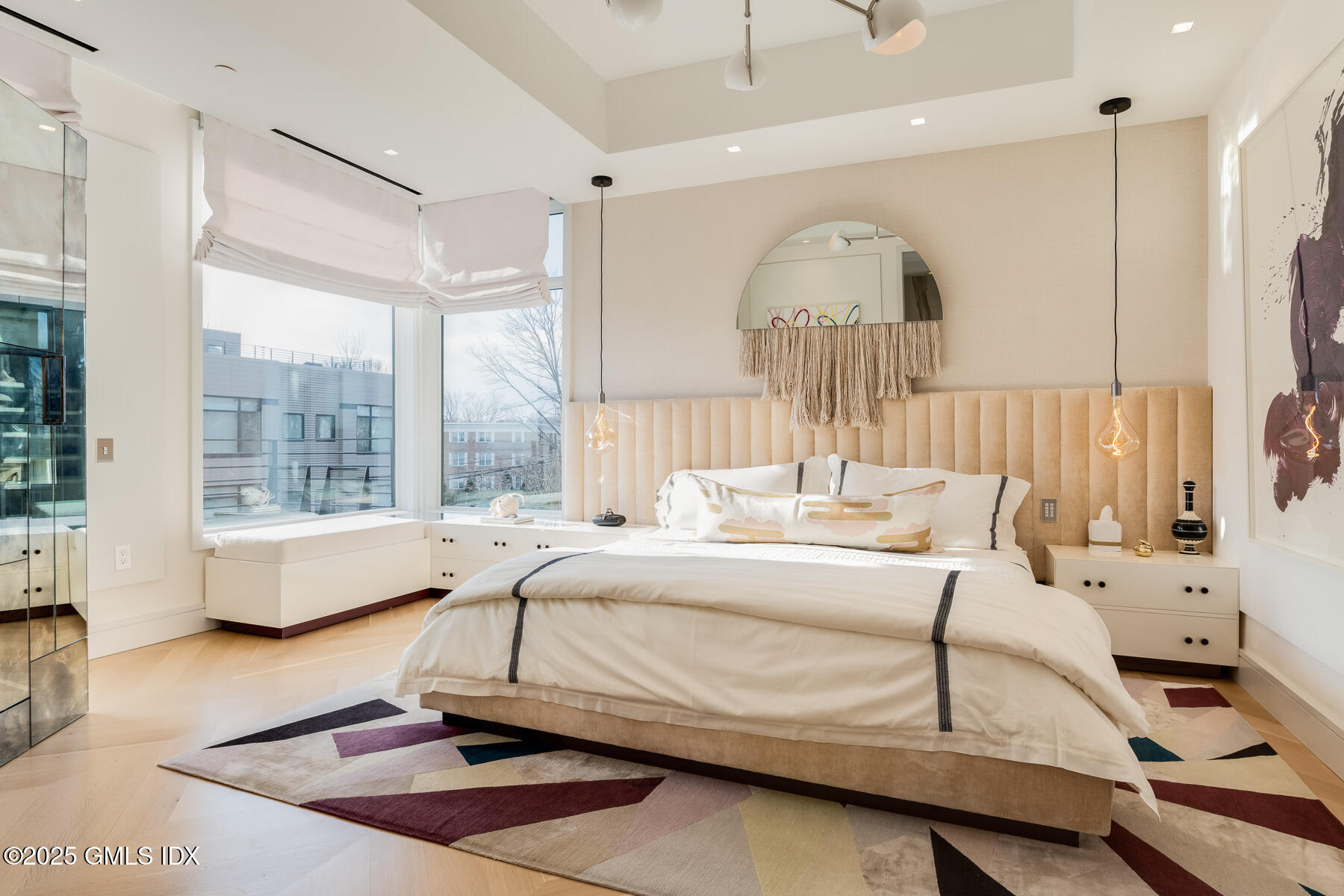 125 Field Point Road, Unit PH A6 Greenwich, CT 06830 - Photo 8 of 22 a spacious bedroom with a bed a table and large window
