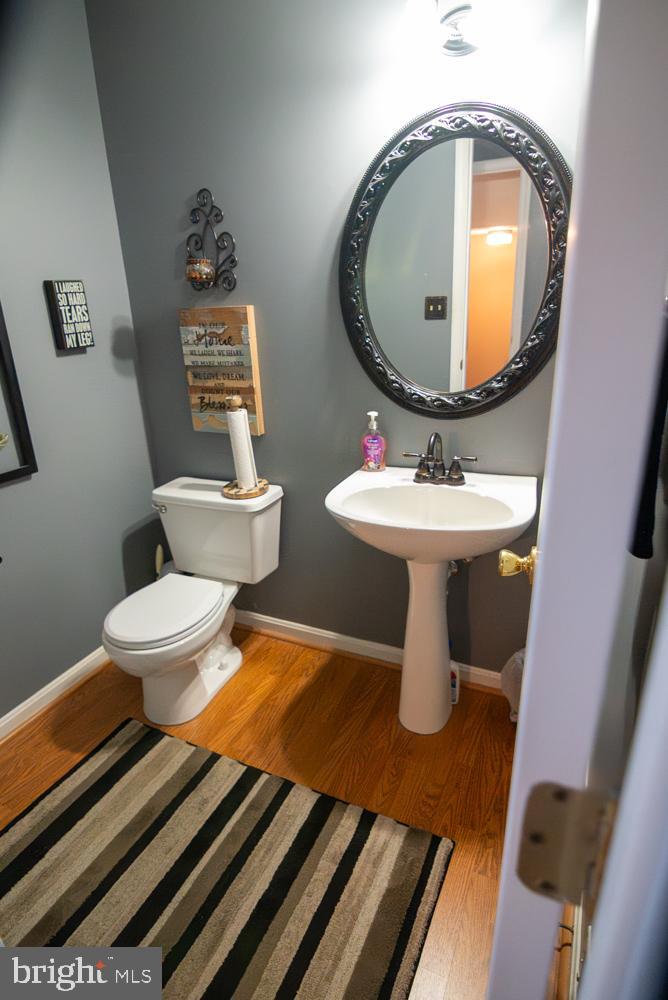 15900 Bald Eagle School Road Brandywine, MD 20613 - Photo 17 of 33 a bathroom with a toilet sink and mirror
