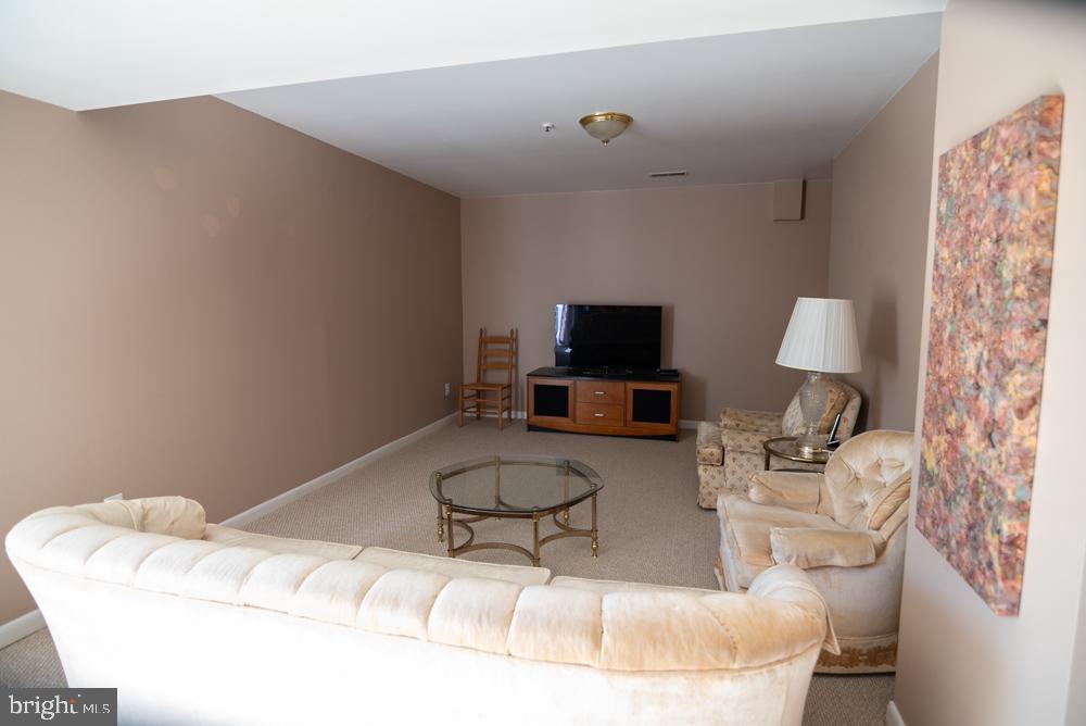 15900 Bald Eagle School Road Brandywine, MD 20613 - Photo 19 of 33 a living room with furniture and a flat screen tv