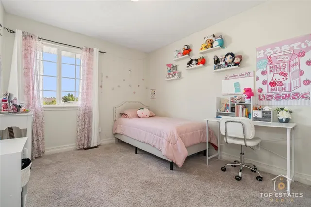 a bedroom with a bed and a window