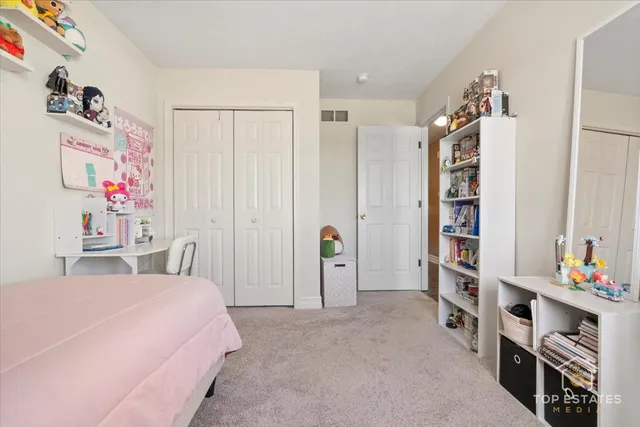 a bedroom with furniture and a chandelier