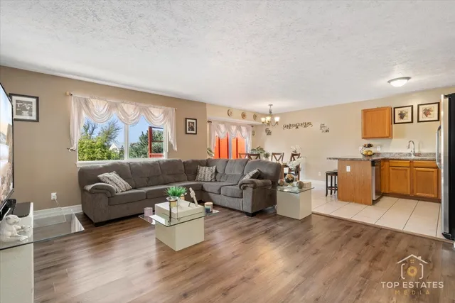 a living room with furniture and a large window