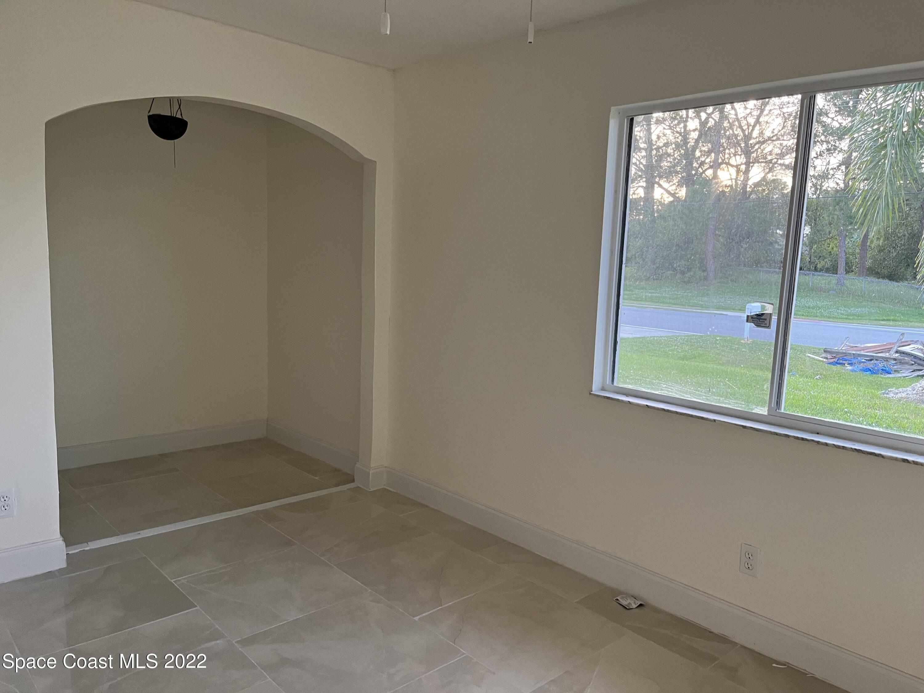 219 Eldron Boulevard Southeast Palm Bay, FL 32909 - Photo 7 of 9 an empty room with a window