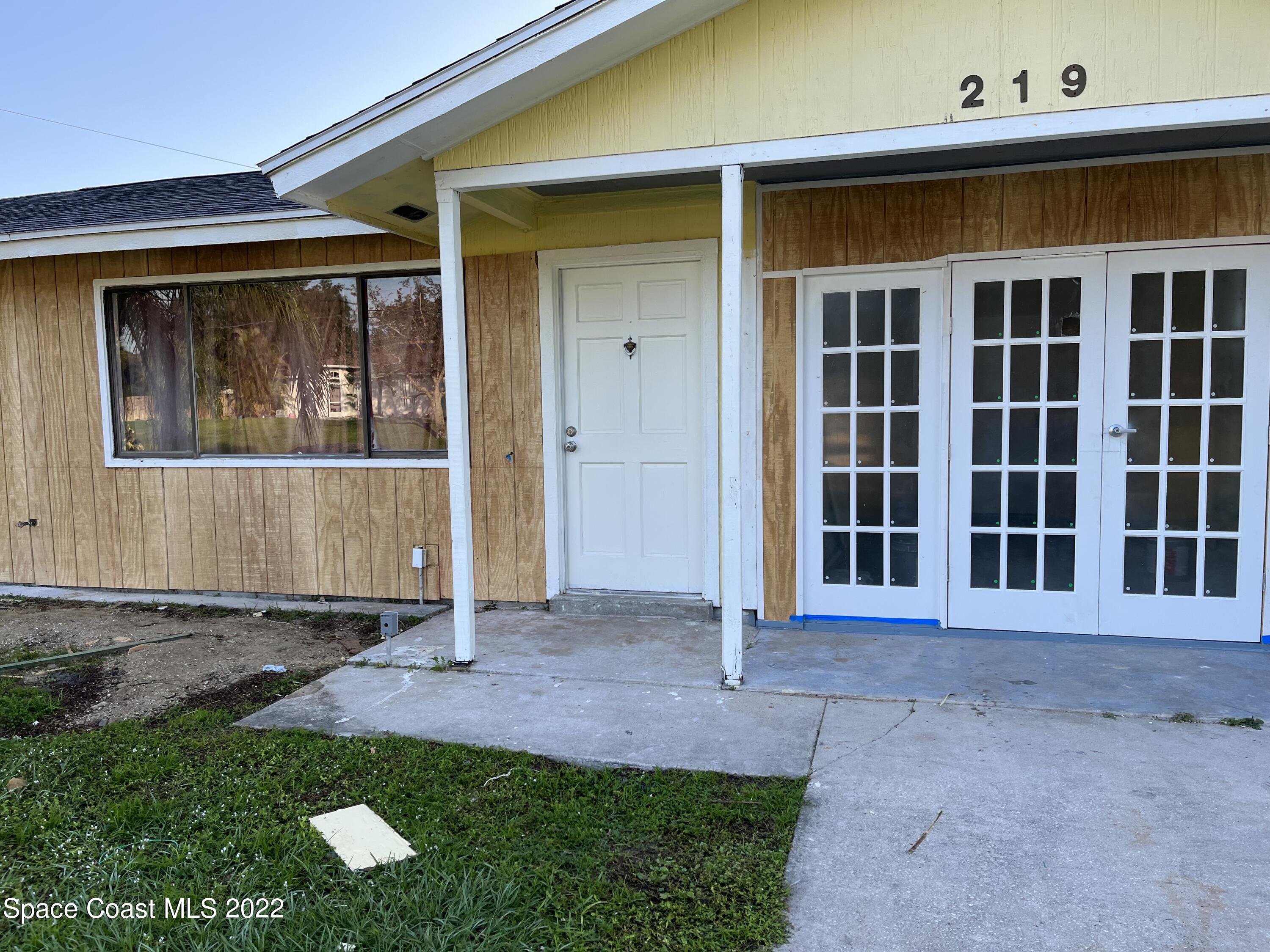 219 Eldron Boulevard Southeast Palm Bay, FL 32909 - Photo 9 of 9 front view of a house with a yard
