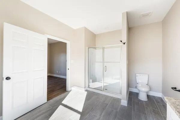 a view of wooden floor in an empty room