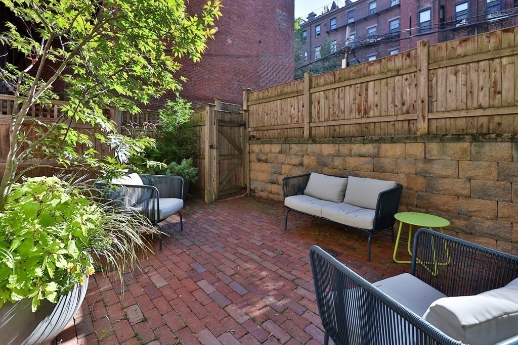 28 Rutland Square, Unit 1 Boston, MA 02118 - Photo 16 of 16 a view of a patio with couches and potted plants