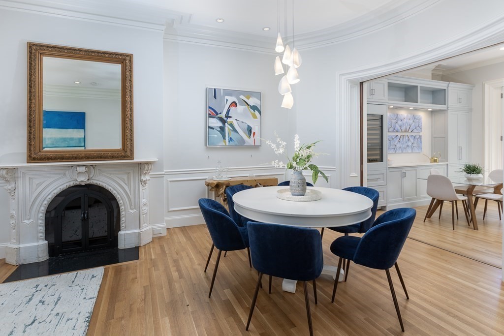 28 Rutland Square, Unit 1 Boston, MA 02118 - Photo 4 of 16 a view of a dining room with furniture and wooden floor