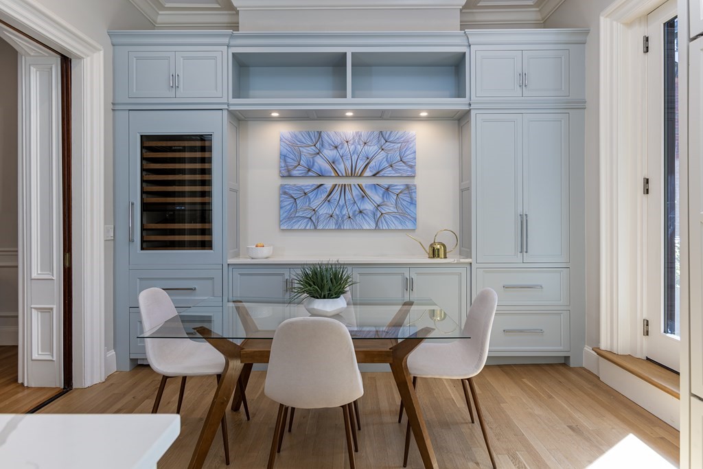 28 Rutland Square, Unit 1 Boston, MA 02118 - Photo 5 of 16 a view of a dining room with furniture and chandelier
