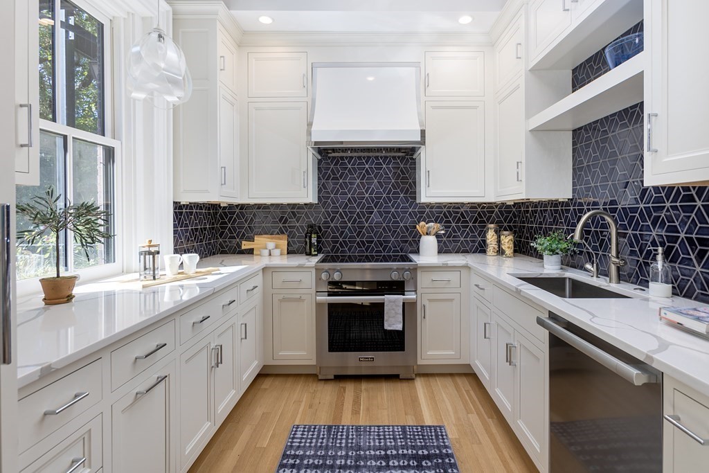 28 Rutland Square, Unit 1 Boston, MA 02118 - Photo 6 of 16 a kitchen with a sink stove and cabinets