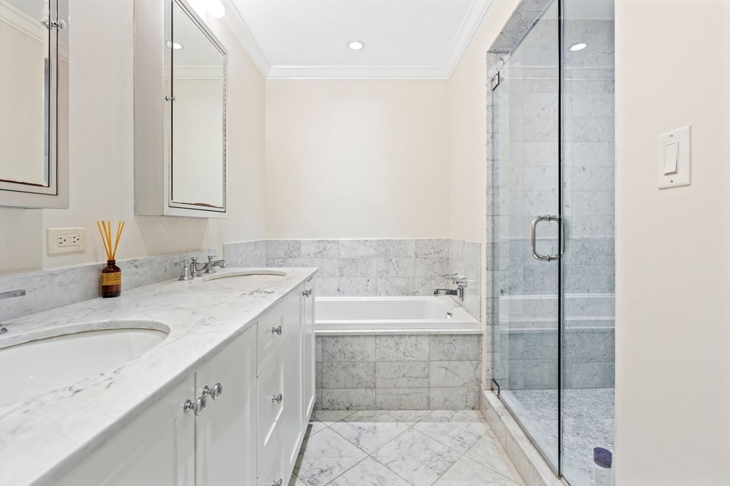28 Rutland Square, Unit 1 Boston, MA 02118 - Photo 9 of 16 a bathroom with a tub sink and mirror