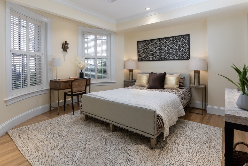28 Rutland Square, Unit 1 Boston, MA 02118 - Photo 10 of 16 a bedroom with a bed a table and chair
