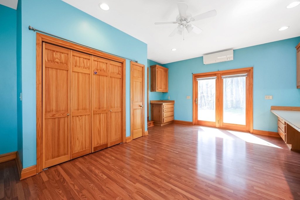 6 Ryan Road Townsend, MA 01474 - Photo 13 of 41 a view of an empty room with a window and wooden floor