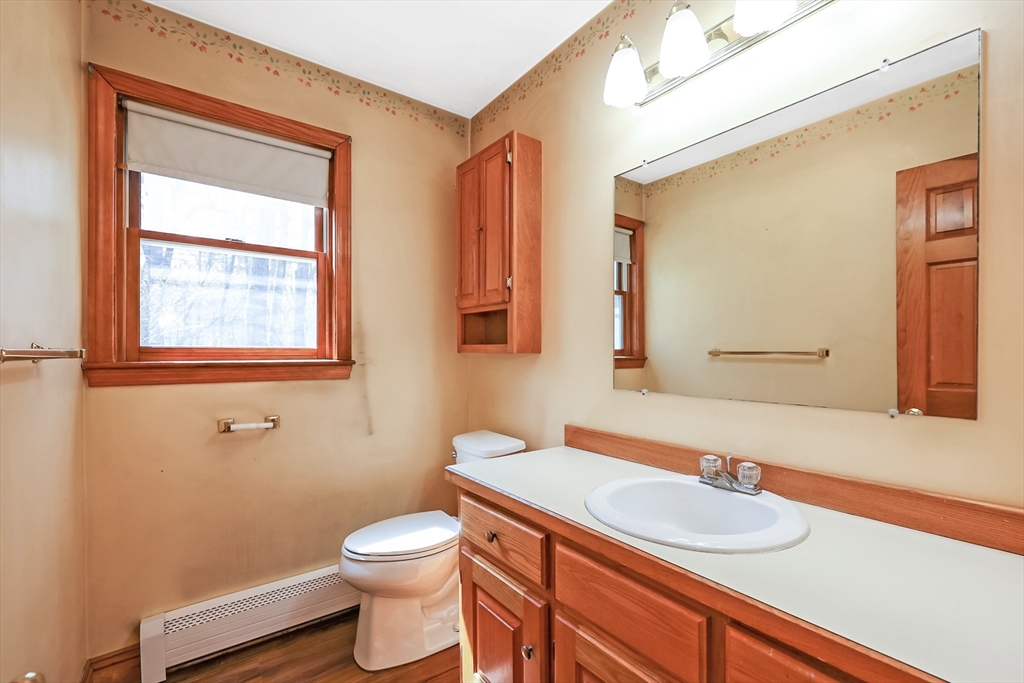 6 Ryan Road Townsend, MA 01474 - Photo 15 of 41 a bathroom with a sink a toilet and mirror