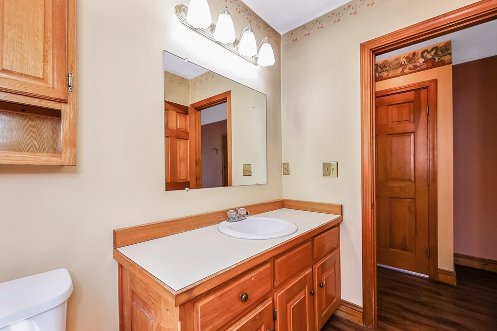 6 Ryan Road Townsend, MA 01474 - Photo 16 of 41 a bathroom with a sink a toilet and mirror