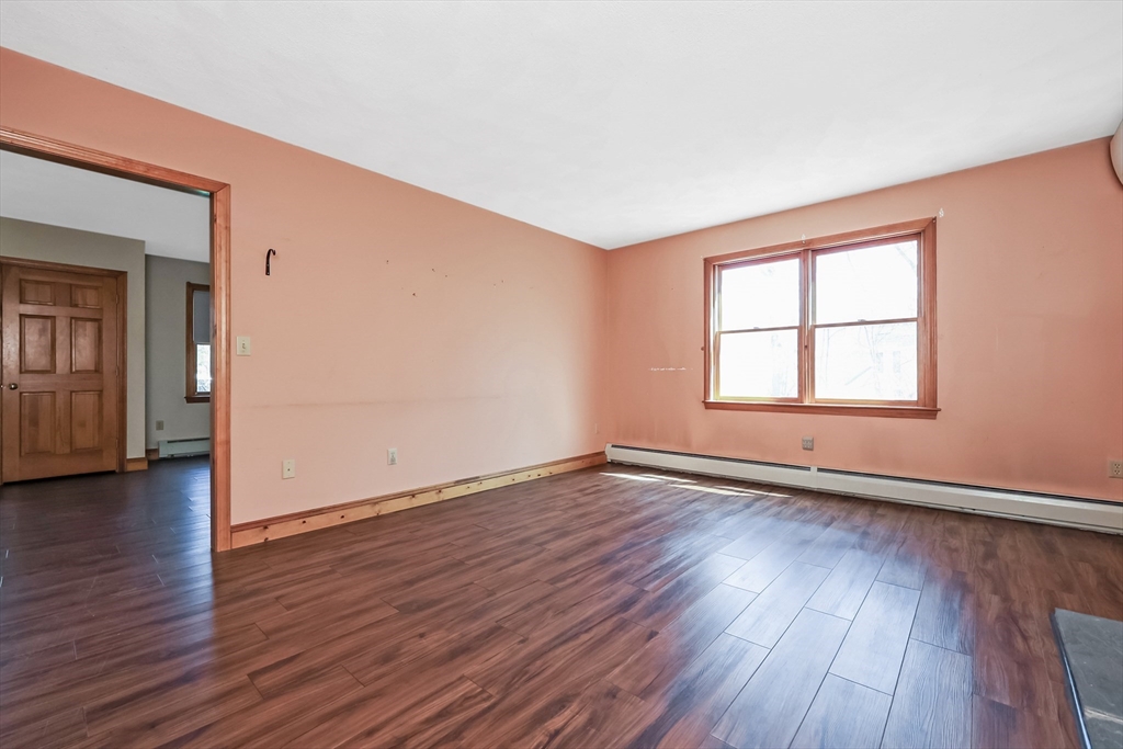 6 Ryan Road Townsend, MA 01474 - Photo 19 of 41 an empty room with wooden floor and windows