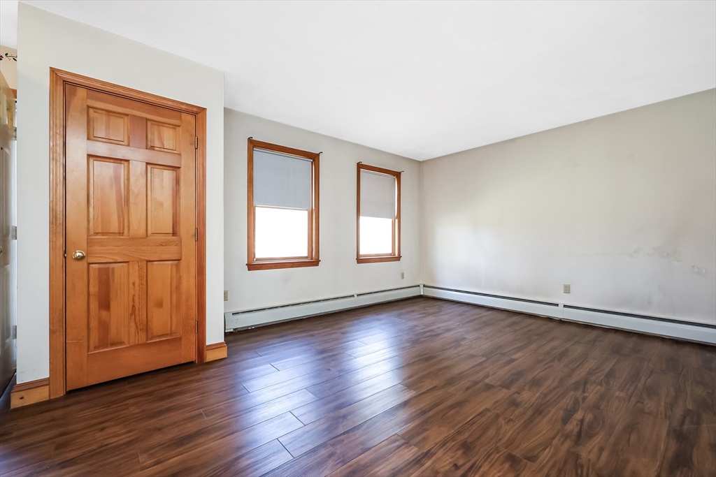 6 Ryan Road Townsend, MA 01474 - Photo 20 of 41 an empty room with wooden floor and windows