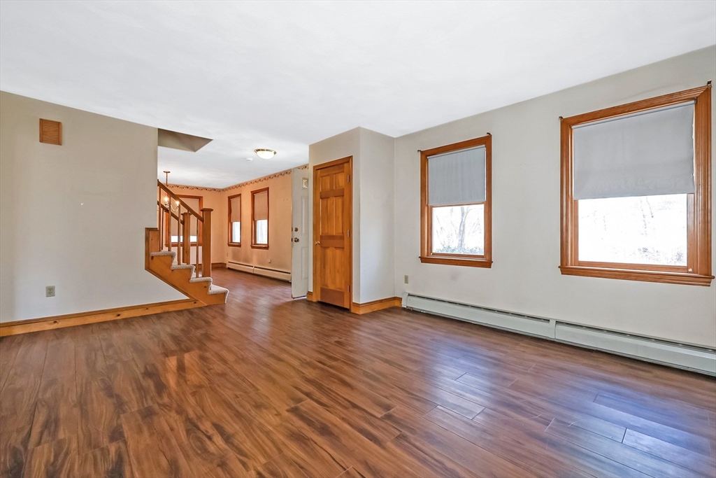 6 Ryan Road Townsend, MA 01474 - Photo 21 of 41 a view of an empty room with glass door and wooden floor