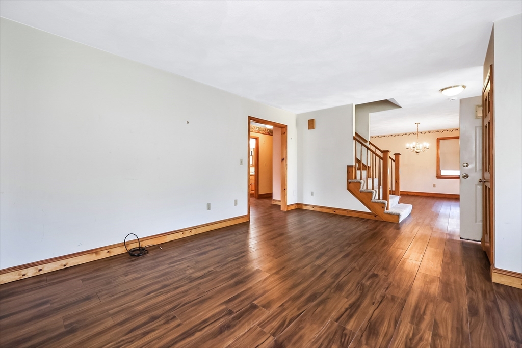 6 Ryan Road Townsend, MA 01474 - Photo 22 of 41 an empty room with wooden floor and windows