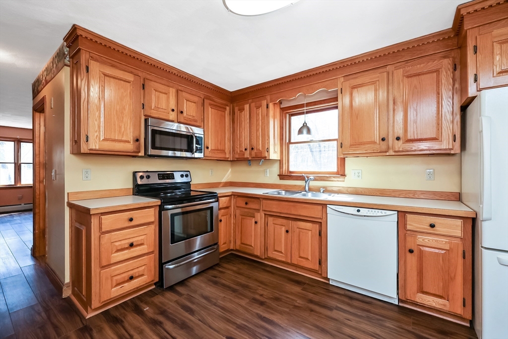 6 Ryan Road Townsend, MA 01474 - Photo 3 of 41 a kitchen with stainless steel appliances granite countertop a sink a stove and cabinets