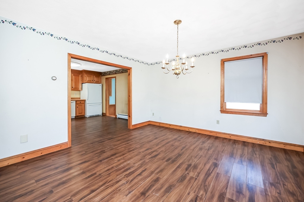 6 Ryan Road Townsend, MA 01474 - Photo 6 of 41 a view of an empty room with wooden floor and a window