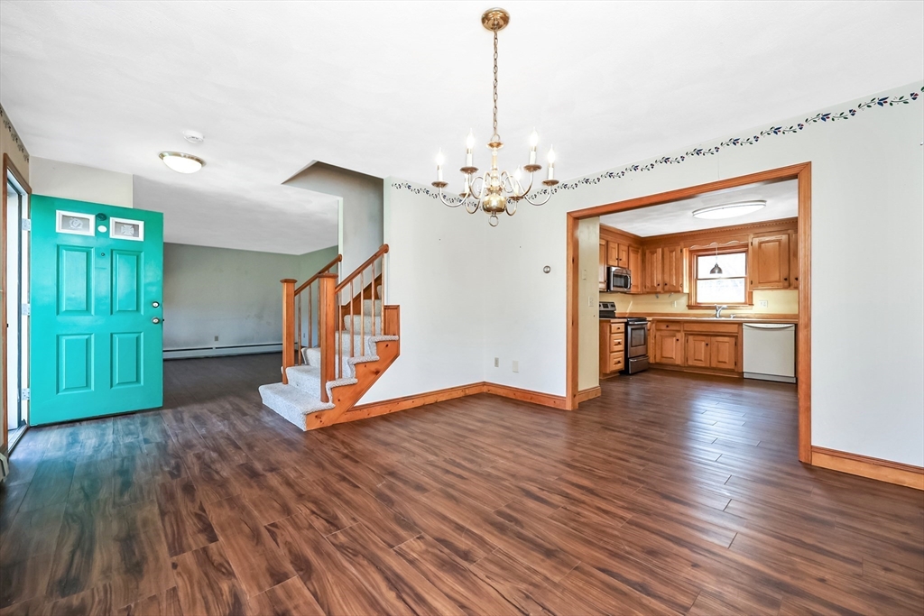 6 Ryan Road Townsend, MA 01474 - Photo 8 of 41 a view of an empty room with window and wooden floor
