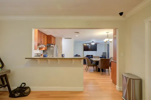 a view of a dining room with furniture and wooden floor