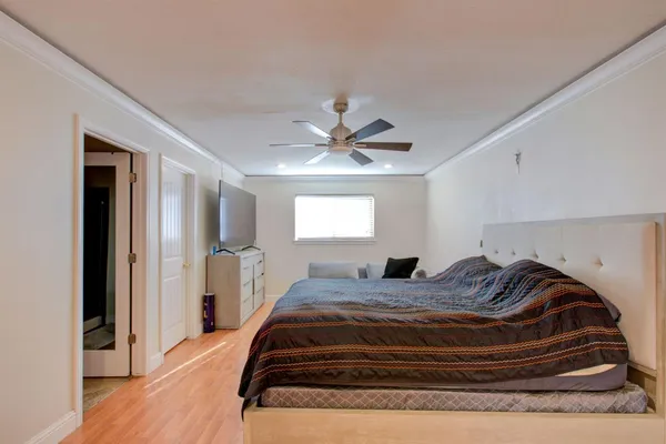 a bedroom with a bed and window