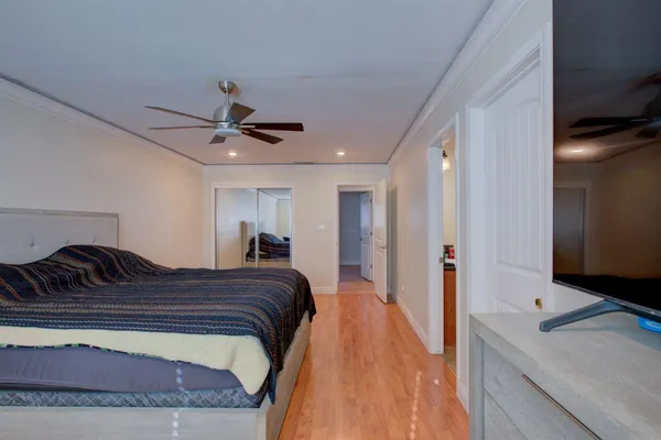 a bed room with a bed and a chandelier