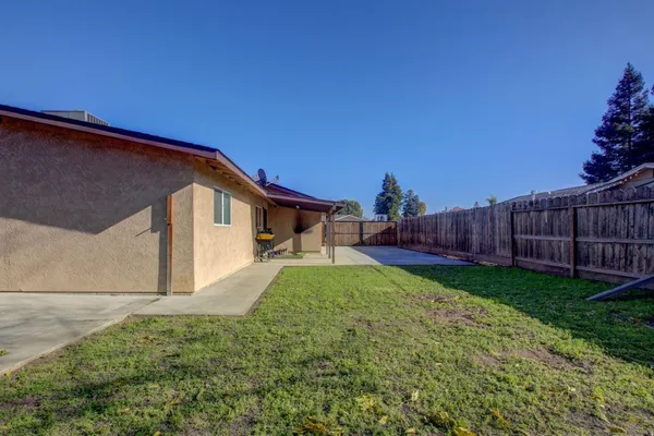 a backyard of a house with lots of green space