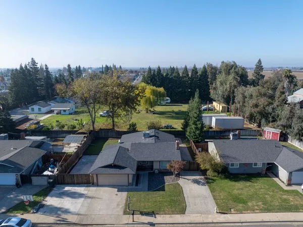a view of houses with yard and outdoor seating