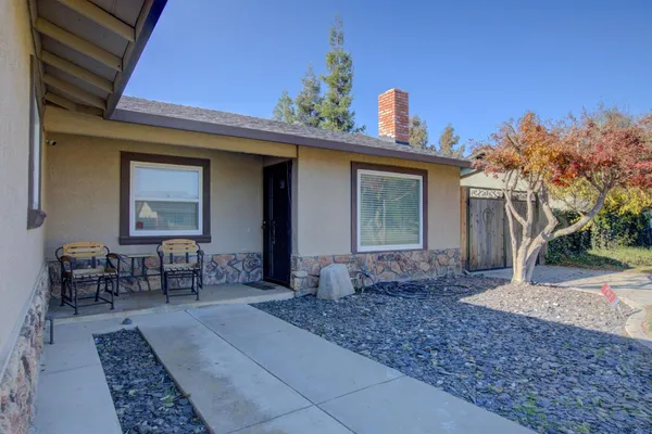 a view of a dinning table and chair in the patio