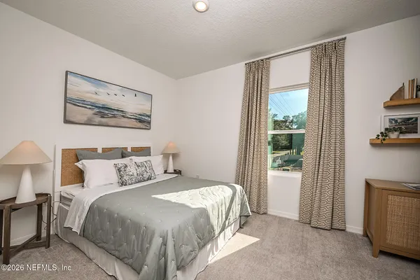 a bathroom with a toilet a sink and a mirror