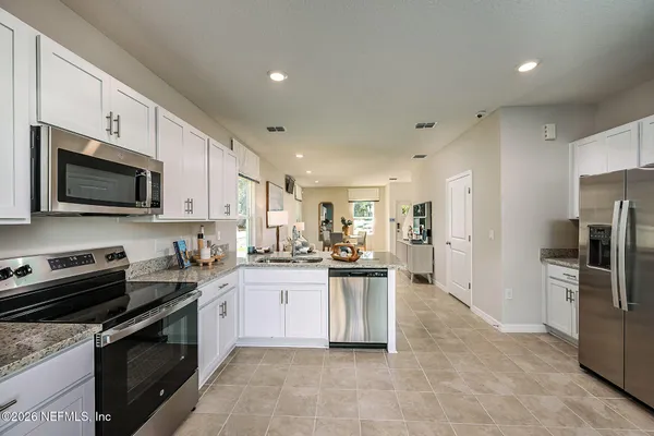 a living room with furniture and a table