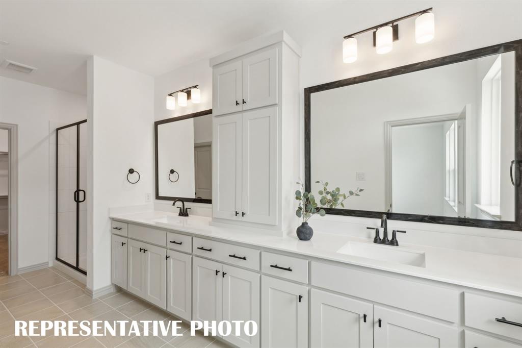 1373 Rooted Road Frisco, TX 75033 - Photo 9 of 12 With ample vanity space for two and a spacious walk in shower, your dream owner's bath awaits! REPRESENTATIVE PHOTO