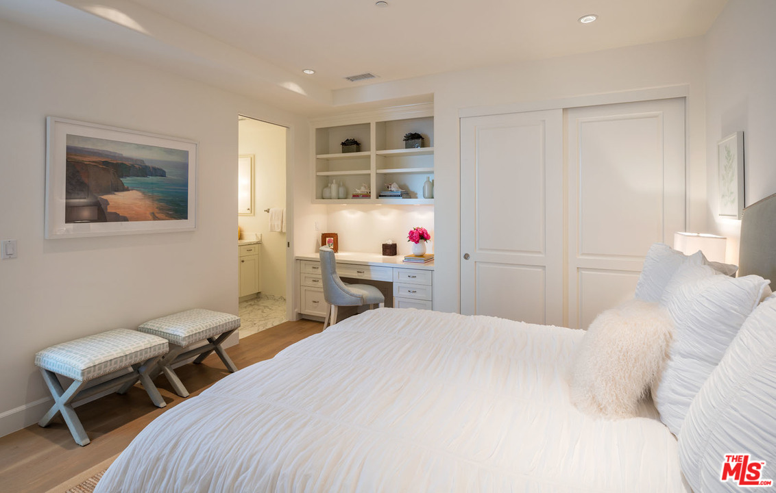 31418 Broad Beach Road Malibu, CA 90265 - Photo 14 of 23 a bedroom with a bed and a chair