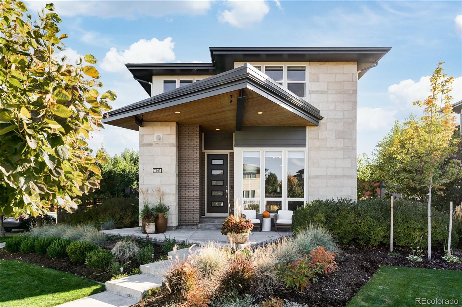 7790 East 32nd Avenue Denver, CO 80238 - Photo 1 of 40 a view of a dinning table and chairs in patio