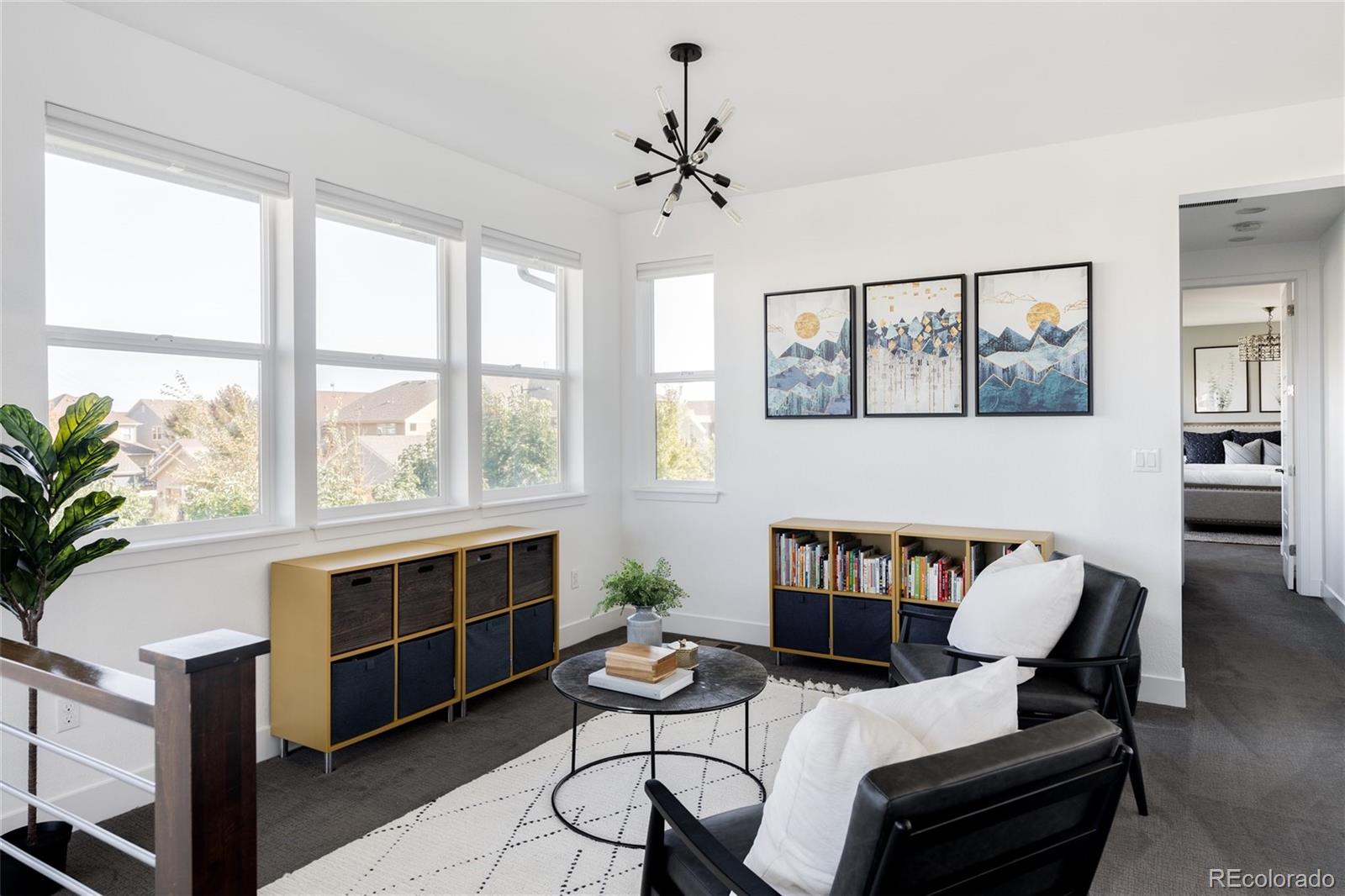 7790 East 32nd Avenue Denver, CO 80238 - Photo 15 of 40 a living room with furniture and a fireplace
